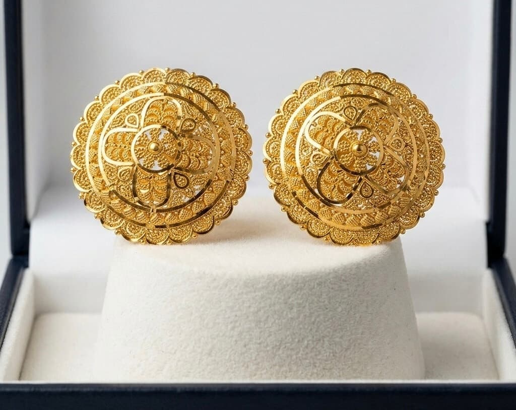 A pair of round 22ct gold filigree stud earrings in a gift box