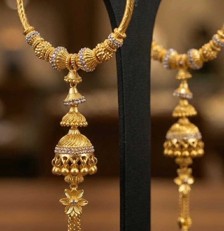 Close-up of 22ct gold hoop earrings with beaded jhumka drops